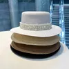 Cappelli larghi cappelli da secchio di cappelli a goccia a goccia a paglia piatta decorazione perle per la protezione estiva di cappello solare da donna con cappello da remitteo da bagno j240506