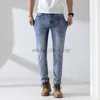 Jeans designer per maschi jeans maschile sottili stagionali di lusso di lusso, versatili elastic slim fit piccoli pantaloni da uomo a gamba dritta