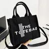 2024 DE TOTE TASS Designer tas schoudertassen vrouwen reizen handtas modieuze crossbody tas canvas open hoge capaciteit boodschappentassen ritssluiting