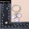 Keychains Lanyards süße Schlüsselbund Emaille Hunde P Key Ring Fußabdrücke Schlüsselketten für Frauen Männer Handtasche Anhänger Accessoires DIY handgefertigte Schmuckgeschenke