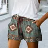 Kvinnors shorts trend kvinnliga shorts elastiska midjeband svett absorption sak retro tryck utdragande lösa shorts y240425