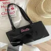 CARBIE girl bright face shoulder bag Female Minority design 2022 new hand horizontal armpit uette207k