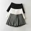Kjolar dptown sommar sexiga minikjolar med korta kvinnors höga midje kjolar vintage veckade kjol koreanska tennis kjolar vita svart y240420
