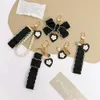 Keychains Lonyards rétro noir amour keychain mode basse arc pendentif pour femmes pour femmes chèques de clés de clés