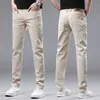 Estilo jeans cáqui europeu para a primavera e verão masculino slim fit small tras reto elástico casual calças de algodão puro comprido
