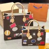 VOYAGE TOTE TAZE WEEKENDE Designer Tassen Handtas Grote capaciteit Winkelen Schoudertas Vintage Hotel Label Stickers Cowhide Lederen Trim canvas Reistassen