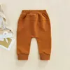 Byxor för byxor för nyfödda pojkar och flickor med en justerbar elastisk midja och en avslappnad stil som är lös och lämplig för byxor med en längd på 0-3tl2404