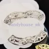 Broches de chat classiques broches bijoux de créateurs 18k vêtements d'or marque de marque broche cristal perle vogue femens de mariage de mariage bijoux de bijoux de bijoux