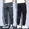 Calça masculina calças de comprimento de tecido macio de vários bolsos elásticos da cintura e de verão
