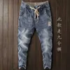 メンズジーンズの贅沢な韓国スタイルの服メンズデニム洗浄された秋のカジュアルストレッチのための弾力性のあるウエストバンドのドローストリング