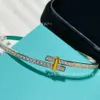 High version quality fashionable trend inlaid zircon dual color split electric cross bracelet RI4Z