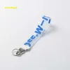 Nyckelringar lanyards mode offs brev nyckelring vit lyxiga nyckelring nyckel kedja transparent gummi gelé bokstav tryck män kvinnor canvas nyckelring kamera hänge 942