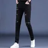 Jeans maschili jeans skinny neri in stile coreano con cerniera ginocchia di lussuoso abbigliamento da strada da strada slim fit fori per abbigliamento casual moto Q240427