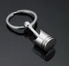 EPACK 20pcs Piston Keychain Keyfob Ring Fashion Metal Metal Piston Carphin Keyfob Motor Fob Cadena de llave KE9747036