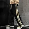 Pantaloni da uomo a strisce vellutoy gamba larga da uomo 2023 pantaloni da carico hip-hop coreano per le pantaloni da corsa per esterni sport di dritta casual