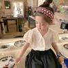 夏の幼児の少女ブラウス日本のスタイルレーストップファッションホーロウアウト衣服INS白いデリケート210529215X