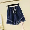 Damesshorts Vintage Lacing Onregelmatige shorts Zomer Nieuwe elastische taille Solid kleur losse jeugd breedbeenbroek Casual mode Vrouwen kleding D240426