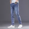 Jeans masculin printemps / été nouveau jeans masculin jeans slim fit petit pantalon de pied tendance petite pieds droits pantalon long décontracté élastique plus pantalon taille