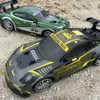 Elektro-/RC -Auto 1/14 RC -Auto 2,4G 4WD -Skala Fernbedienungsauto Hochgeschwindigkeitsfahrzeug Sport Drift Racing Car mit weichem Soundspielzeug für Jungengeschenke Giftl2404