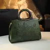 Estilo étnico de couro genuíno de couro genuíno feminino de bolsa nacional macia que se desloca de meia idade de meia-idade