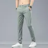 Summer Stretch calças casuais homens finos negócios de moda macia elástica coreana magra roupas masculinas calças cinza preto verde 240422