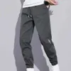 Pantaloni maschili 2024 maschi ad alto elastico pantaloni a tasca taschi pantaloni multisca