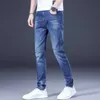 Jeans masculin printemps / été nouveau jeans masculin jeans slim fit petit pantalon de pied jeune tendance élastique pantalon denim de grande taille masculine plus pantalon taille