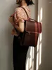 Okul çantaları retro deri kadınlar sırt çantası İngiliz kolej sırt çantaları büyük kapasiteli inek derisi bayan çantası 13 inç bilgisayar 2024
