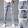 Mäns jeans Vår/sommar Nya herrar Jeans Youth Slim Fit Small Feet Pants Men's Trendy Casual Elastic Large Size Denim Plus Size Pants