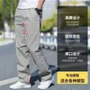 Spodnie męskie Męskie sprężyste/letnie spodnie towarowe bawełniane spodnie robocze nowe luźne i luźne dopasowanie do powolnych biegaczy Korean plecak Travellersl2404