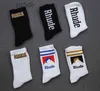 Calzini da uomo Rhude American High Street Trend Socks Super Popular Calzini a maglia per uomini e donne di alta qualità All Seasons Calzini medi Medium Comodo Caldo Fashi Fashi F8K2