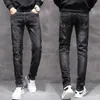 Heren jeans 2022 lente en herfst nieuwe Koreaanse editie heren jeans elastische slanke fit kleine rechte buis heren jeans jeugd zwart grijze broek plus size broek