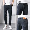 Jeans masculin printemps jeans masculins pour les pieds élastiques pantalon pantalon en denim masculin et pantalon de taille plus