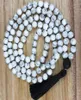 108 Howlite Knotted Mala Halskette Lava Stone Anhänger Perle mit schwarzer Quasten Halskette emotional beruhigend Heilschmuck 5523955