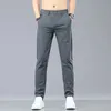Summer Stretch calças casuais homens finos negócios de moda macia elástica coreana magra roupas masculinas calças cinza preto verde 240422