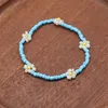 Pärlstav söt daisy pärla armband för kvinnor mode bohemian färgglada charm elastiska fest gåvor smycken grossist