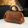 Estilo étnico de couro genuíno de couro genuíno feminino de bolsa nacional macia que se desloca de meia idade de meia-idade