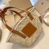 Bolsas de praia Bolsa de bolsa de bolsa de luxo Bolsa de palha de palha feminino Personalidade de palha feminina retalhos de retalhos de tela floral Apliques de moda Totes Bolsa