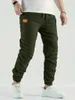 Men's Pants 2024 New jogger cargo pants mens harem pants hip-hop casual multi pocket mens sports pants mens sports pantsL2403