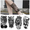 Tatuagem Transferência de 12pcs/Defina o adesivo de tatuagem da floresta negra para homens mulheres tigre lobo crânio temporário falsa henna esqueleto rei animal tatoo 240426