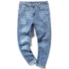 Jeans masculin printemps / été nouveau jeans masculin jeans slim fit petit pied édition tendance des grands jeans élastiques bleu clair des hommes et pantalons