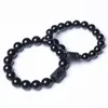 Kralen 10/12mm Natuurlijke zwarte obsidiaan Gewerkte Boeddha Lucky Amulet Circulaire Bead String armband Geschikt voor vrouwelijke mannen sieraden en nieuwjaarscadeaus