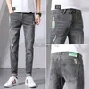 Jeans masculin printemps jeans masculins pour les pieds élastiques pantalon pantalon en denim masculin et pantalon de taille plus