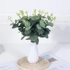 Fleurs décoratives 10pcs plante artificielle en soie eucalyptus qui laisse les branches fausses tiges bouquet pour le vase de fleurs de mariage arrangement floral