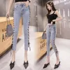 Jeans femminile estate donne fritte stradali elastici sottili piedi dhort pantaloni pantaloni femminile celebrità cinturino cinturino bendaggio in alto 2024