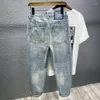 Jeans masculin 2024 Patch de trous haut de gamme de printemps à la mode pour la marque de la rue Fashion Brand lavé rétro usé pantalon de la demin