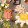 Dekorative Blumen Jungen und Mädchen Bausteine Plastikblumennetz Promi Ins Windpellet zusammengebaut Spielzeug Dekoration Kindertag Geschenk
