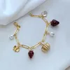 Unikalny styl leśny słodki uroczy projektant biżuterii bransoletki dla kobiet kwiat truskawki perła cztery kwiaty pszczoły miłosne ryby metalowe bransoletki prezent