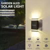 Dekorationer Solväggslampa utomhusvattentät solenergi ljus upp och ner belyser hemträdgårdsdekoration utanför solkastare