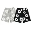 Kvinnors shorts y2k kläder trendiga hip-hop-dragkonstbeslor springrar mens y2k blomma tryck shorts löst och wideleg byxor 240426